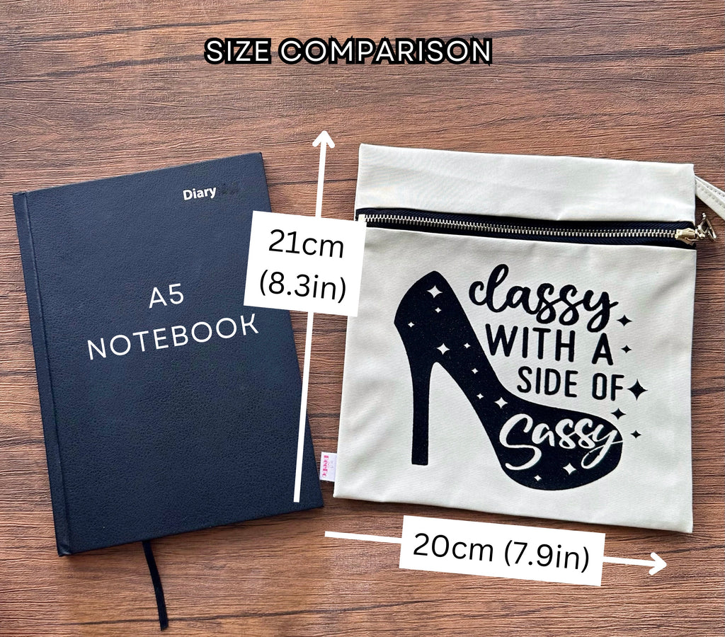 A5 notebook and a pouch with text on a wooden surface, showing size comparison.
