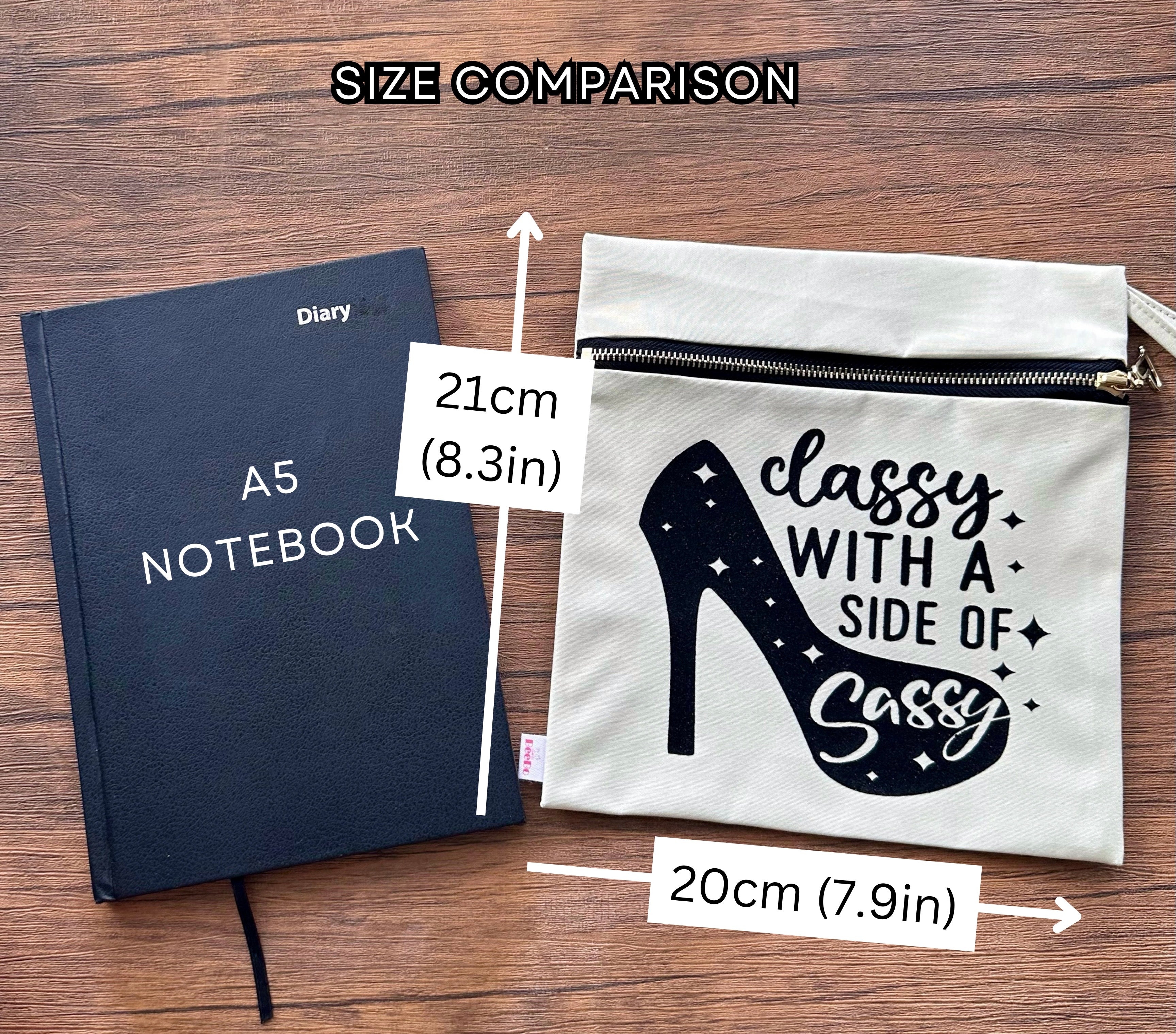 A5 notebook and a pouch with text on a wooden surface, showing size comparison.