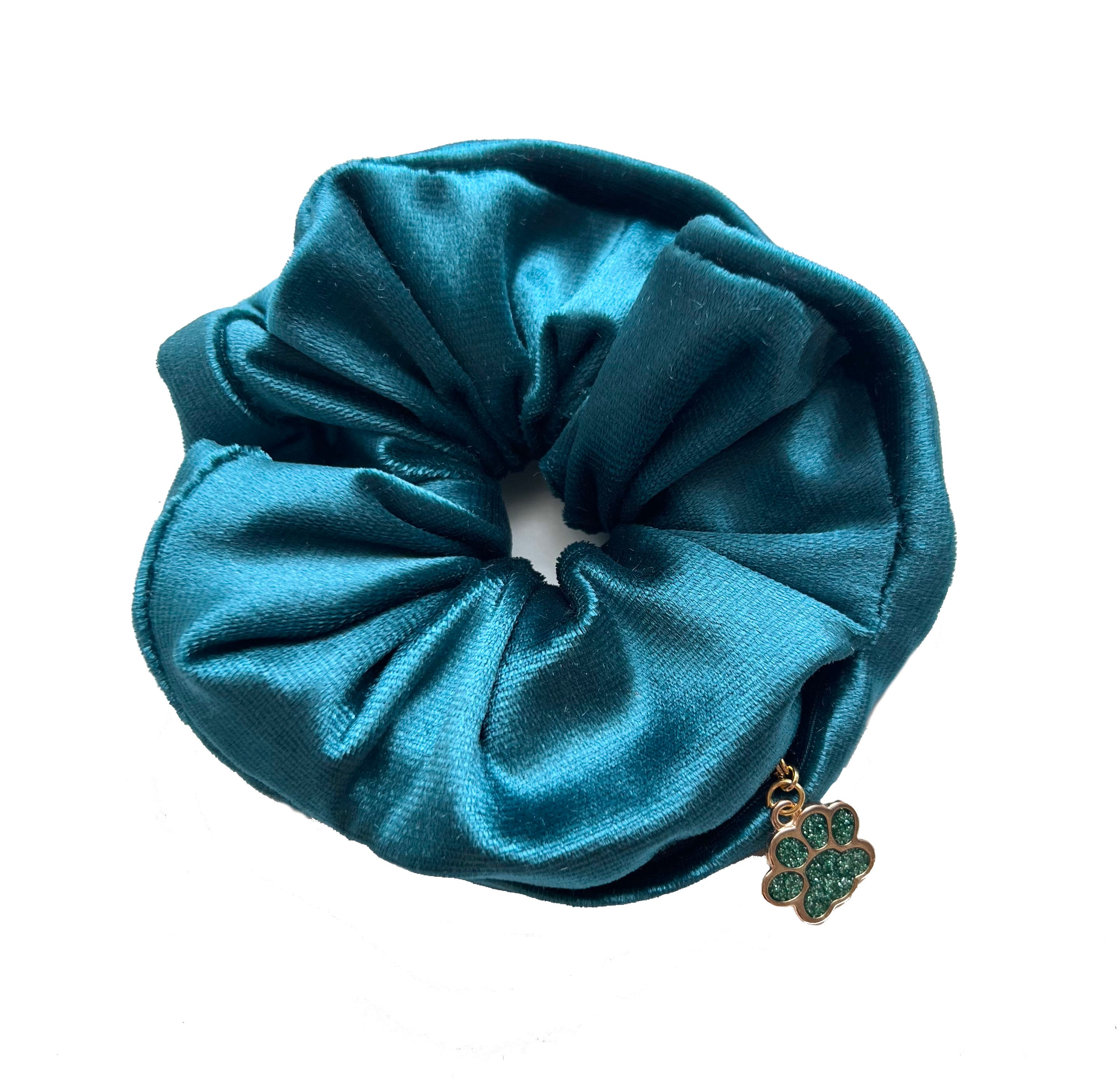Emerald teal velvet scrunchie with cute charm on a white background