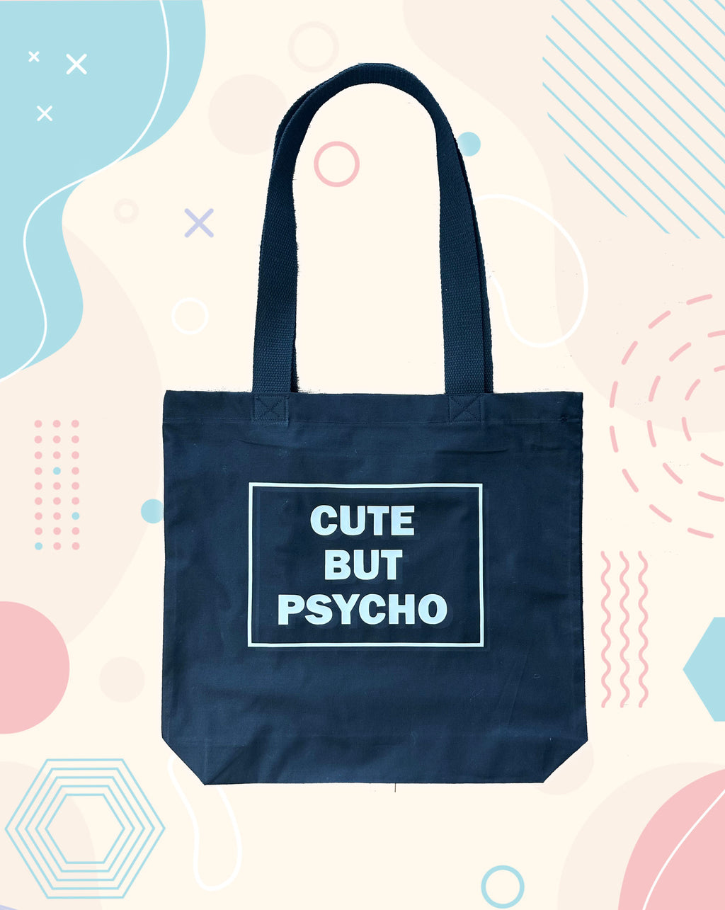 Black tote bag with 'Cute But Psycho' text on a colorful background handmade